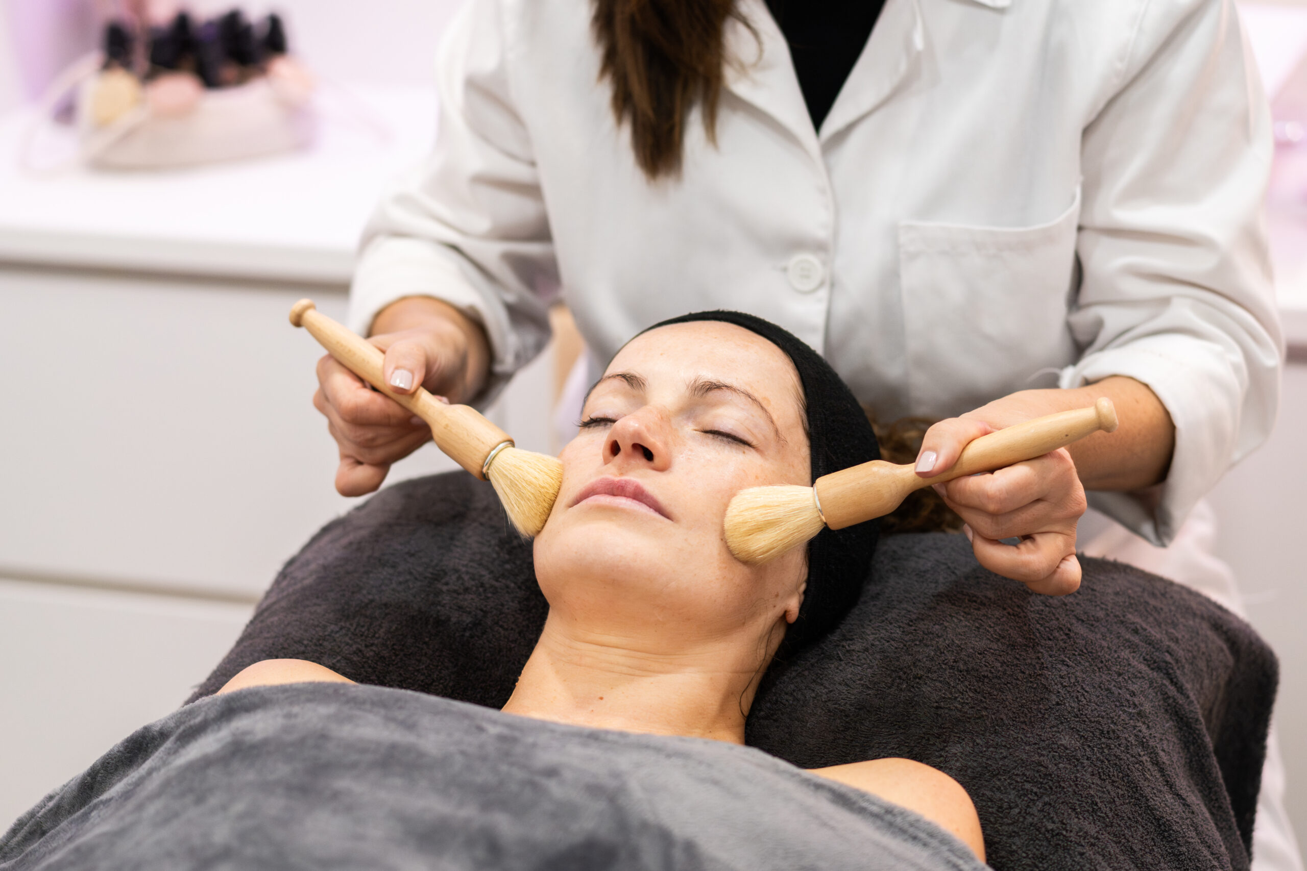 anonymous-beautician-massaging-face-of-woman-in-sa-2025-03-25-07-58-02-utc