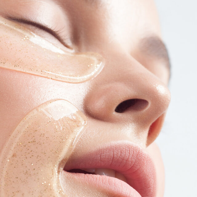 Close-up of young caucasian female with glittering face masks for skincare.